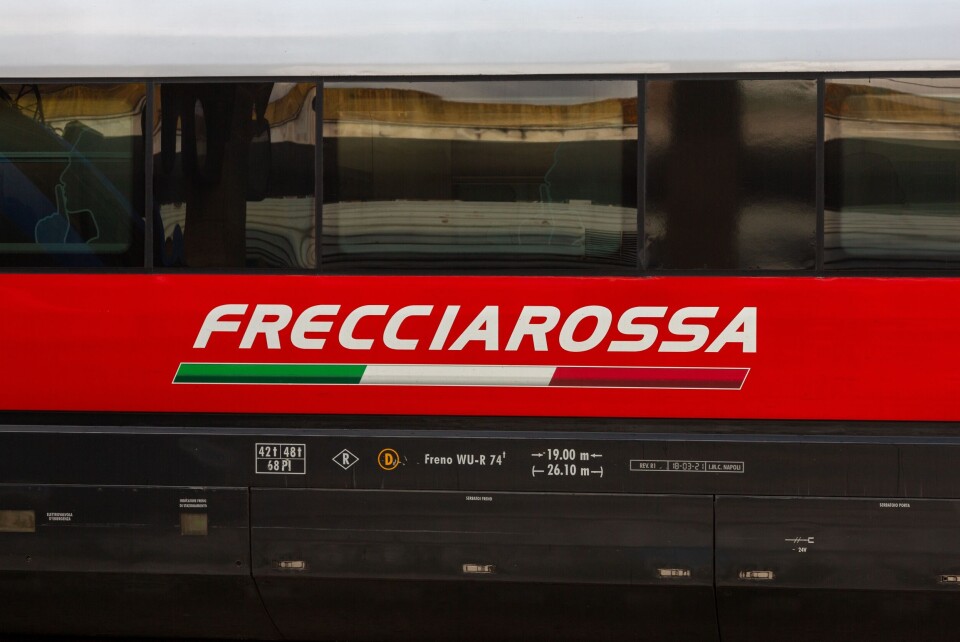 Fortgens Photography / Shutterstock A photo of the FrecciaRossa service logo on a Trenitalia train