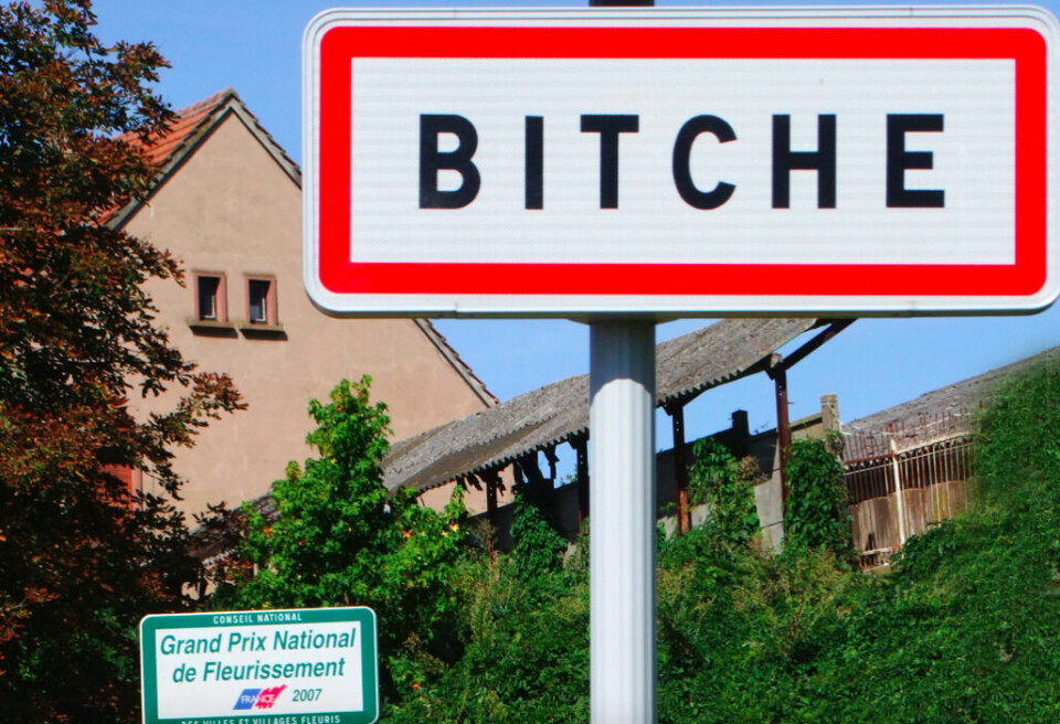 Town name sign in Bitche. French town name Bitche censored on Facebook