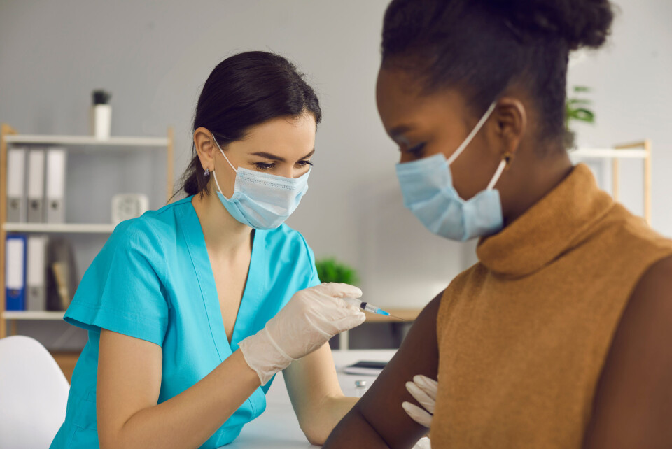 Studio Romantic / Shutterstock A woman receives a Covid-19 vaccination