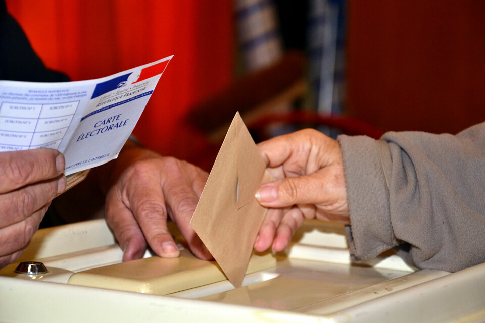 Person voting in French elections. Which French regions look set to vote far right in June’s elections?