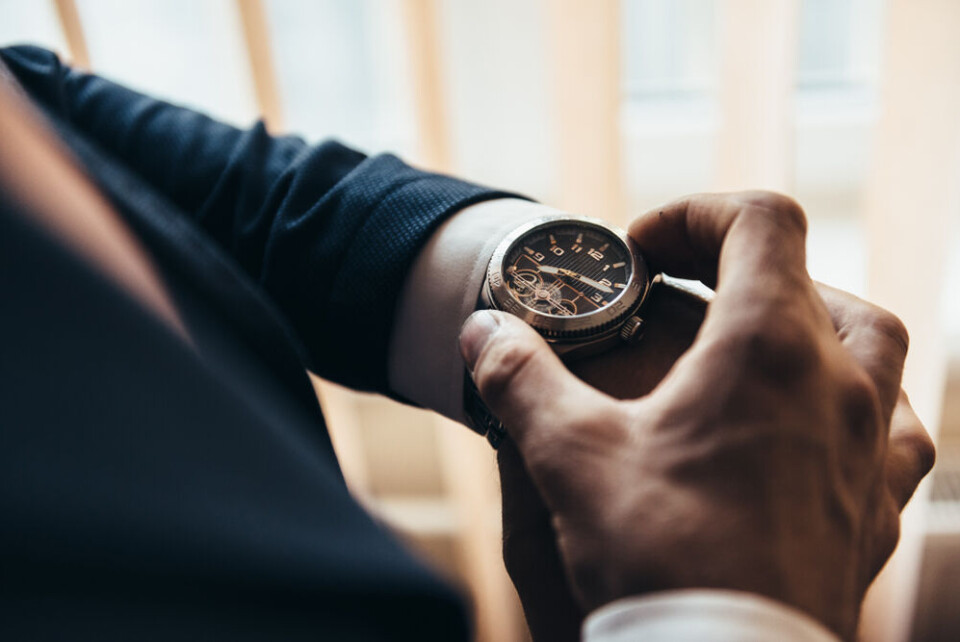 A man checks his watch