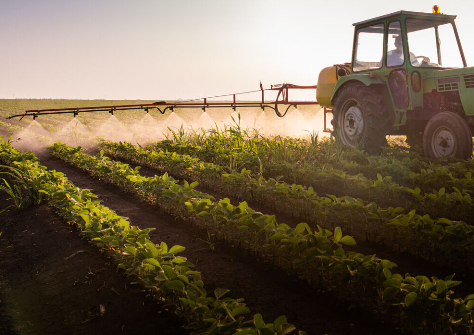 Fotokostic / Shutterstock A tractor spreading pesticides on a field. France’s highest court says government must improve pesticide rules