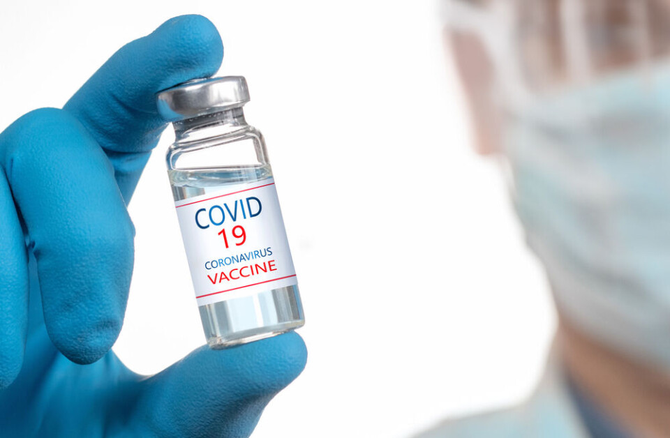 PalSand / Shutterstock Coronavirus Vaccine in glass bottle in hand of doctor blue vial. Macron to Covid anti-vaxxers: Freedom relies on reciprocal duty