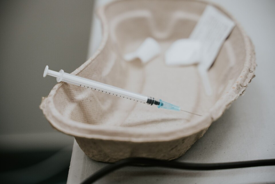 Used vaccine syringe on a paper tray. Lockdown still needed for vaccinated people, rules French court