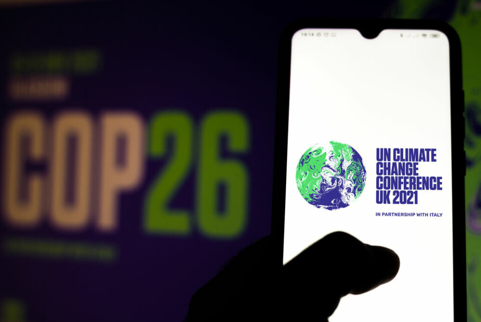the 2021 United Nations Climate Change Conference (COP26) logo seen displayed on a smartphone