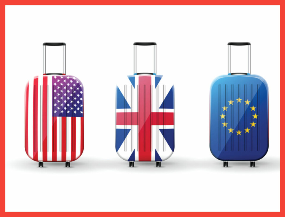Suitcases with EU, UK and US flags