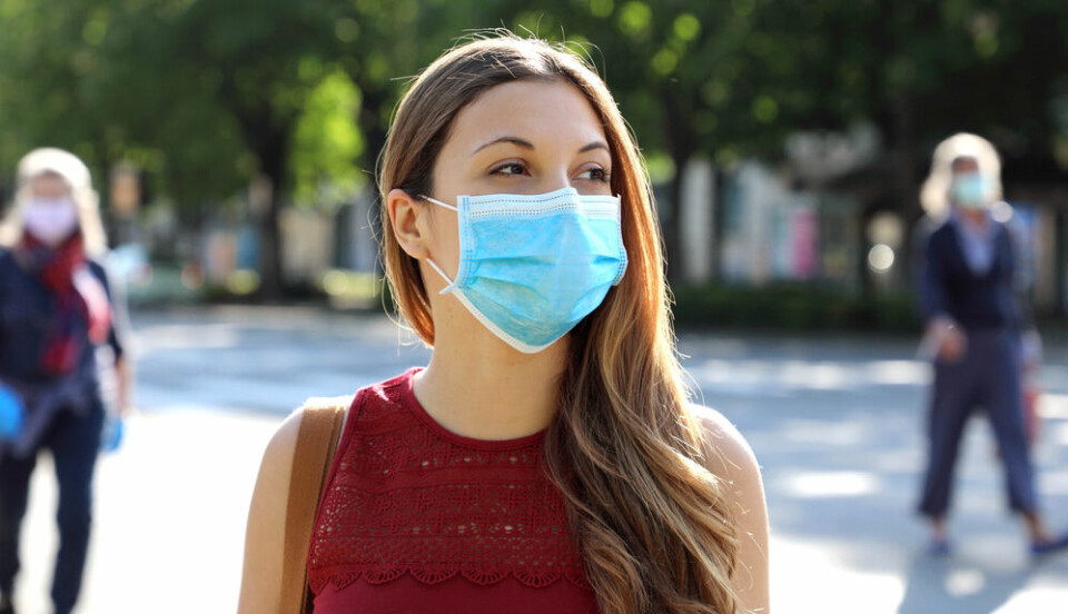 A woman wears a mask outside. Making masks mandatory outside ‘counterproductive’, says French GP