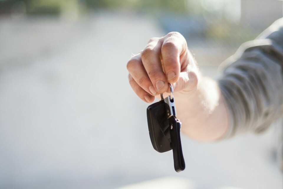 A man handing over some car keys. Hire car shortage in France ahead of post-lockdown summer 2021