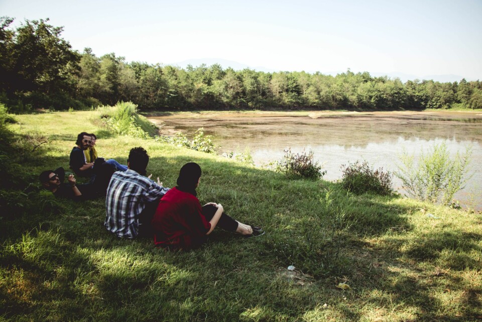 Group sitting by the water. Six questions on the semi-lockdown starting across France Saturday