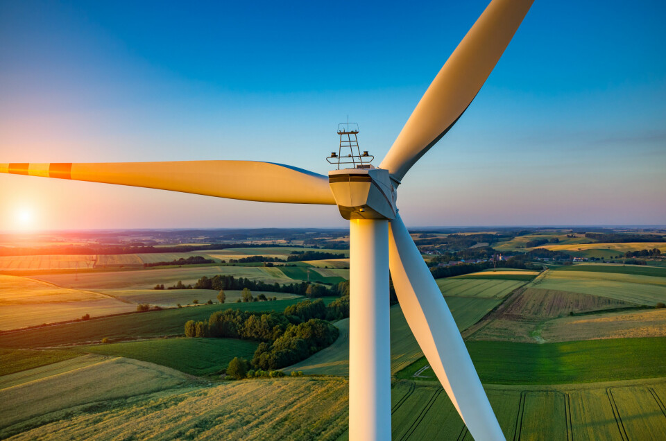 A view of a sunset from a wind turbine in a rural location