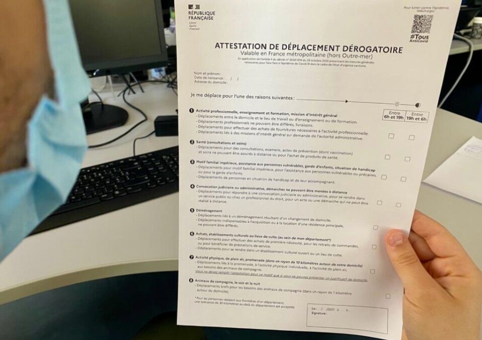 France 3 Corse / @FTViaStella / Twitter A man holds a new attestation form. Travel distances and link to forms for new 10km lockdown in France