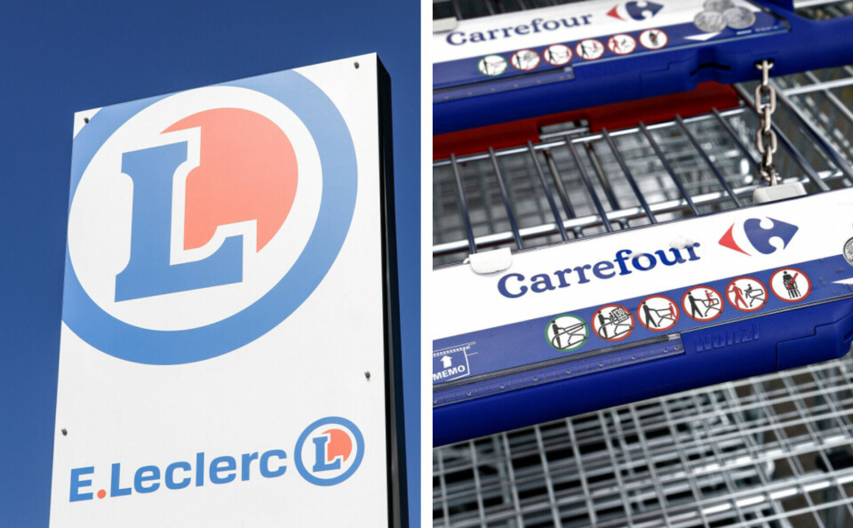Signs and trollies showing E. Leclerc and Carrefour supermarket logos
