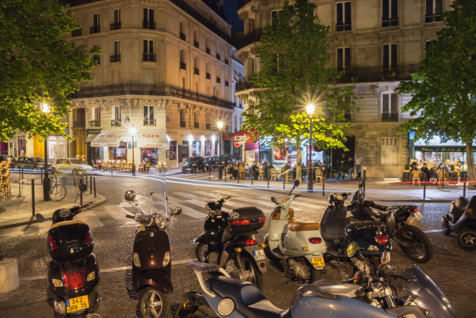 A view of motorbikes parked on a street in Paris