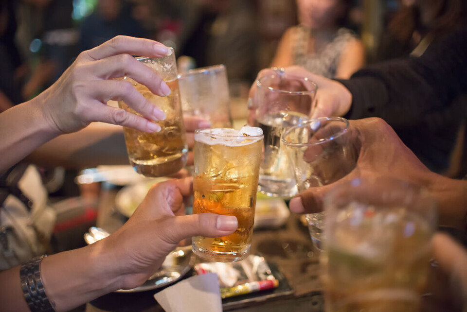 Pra Chid / Shutterstock A group of people ‘cheersing’ with glasses of alcohol drinks