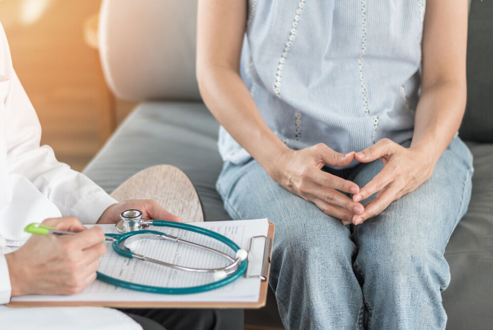 A view of a woman having a stressful consultation with a doctor