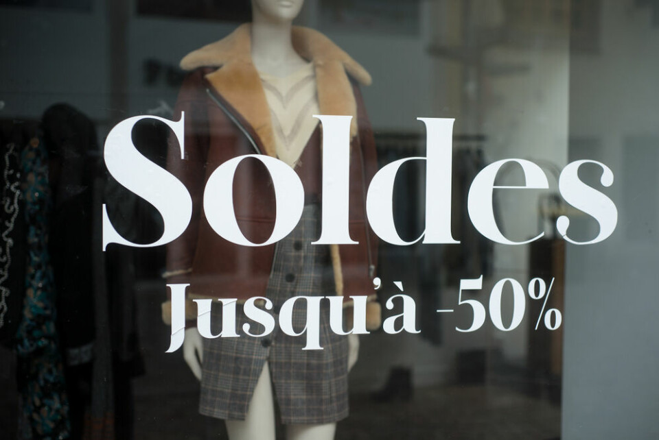 Closeup of discount sign saying ‘Soldes jusqu'a 50%’