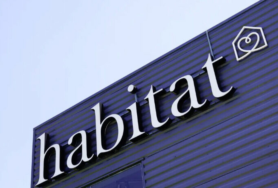 A view of the Habitat logo on the side of a store