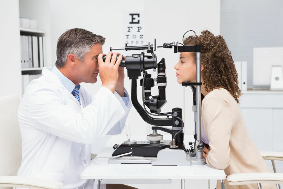 A view of a woman having an eye check up