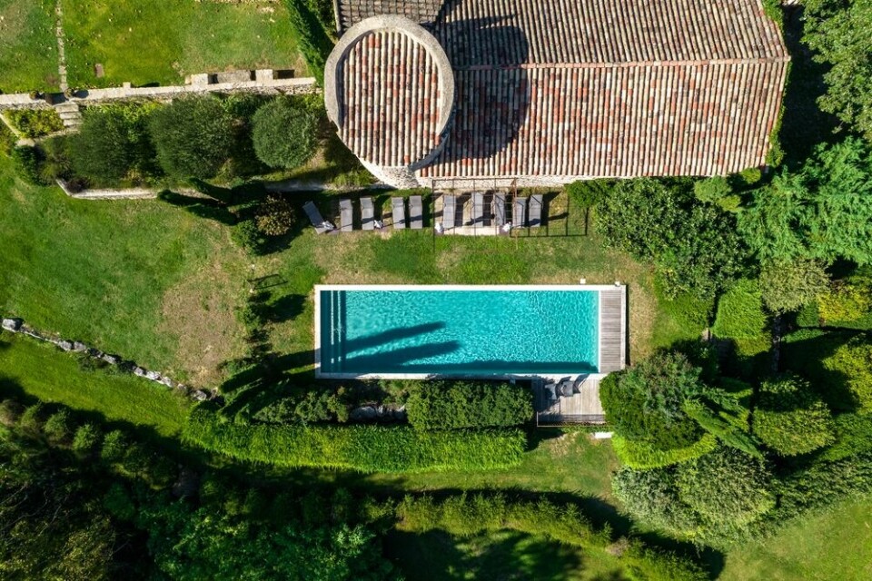 An aerial view of a swimming pool at a house in France