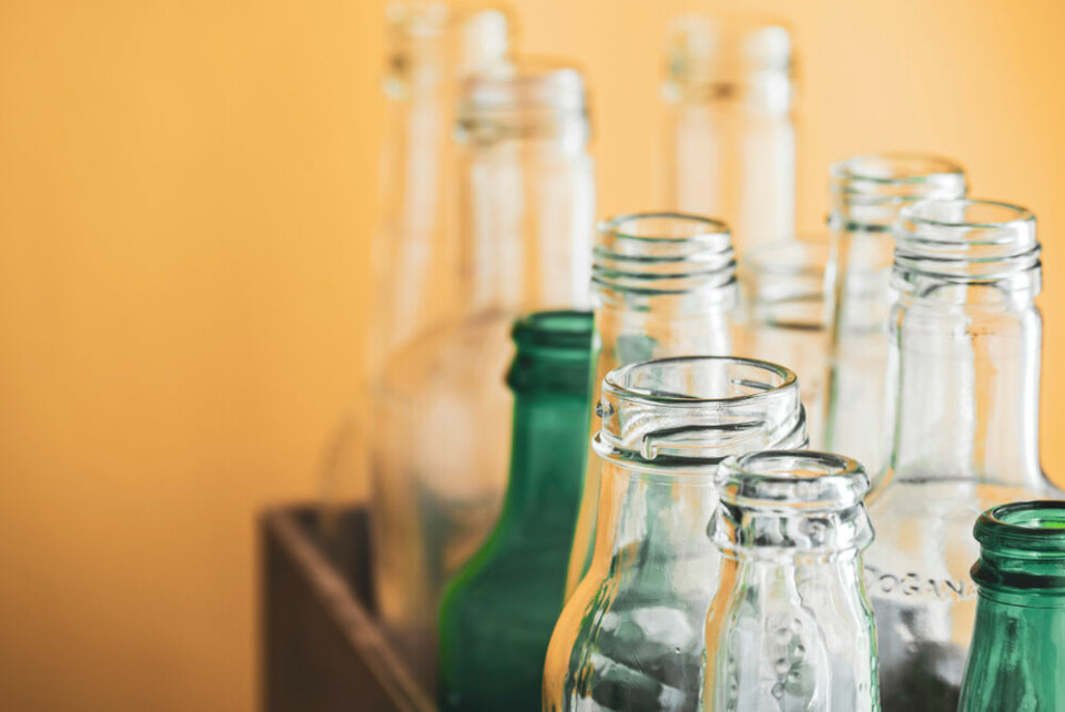 A view of a box of empty glass bottles