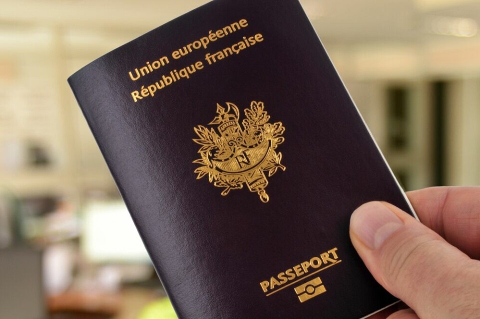 A view of someone holding a French passport