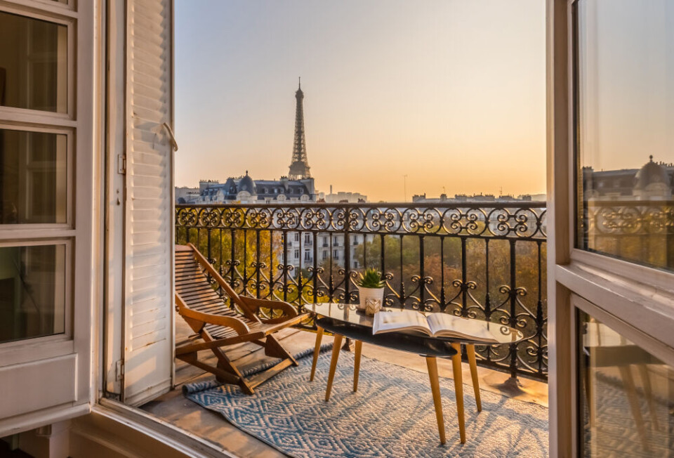 karen mandau / Shutterstock A view of the Eiffel Tower from a balcony of a luxury apartment