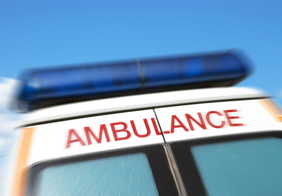 A view of an ambulance with blue lights