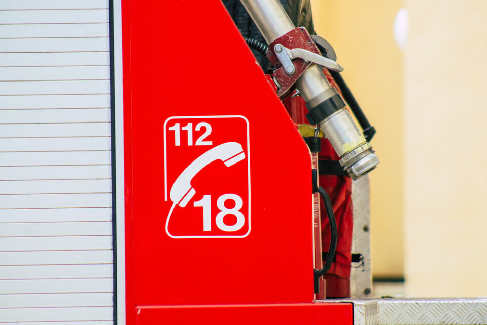 A view of a fire engine in France with the emergency numbers 18 and 112