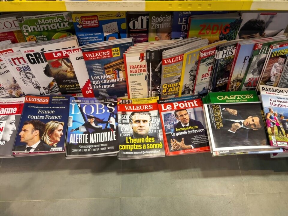 A view of political magazines at a news kiosk in France