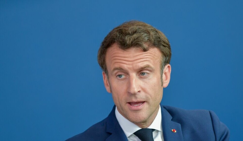 A view of President Macron against a blue background