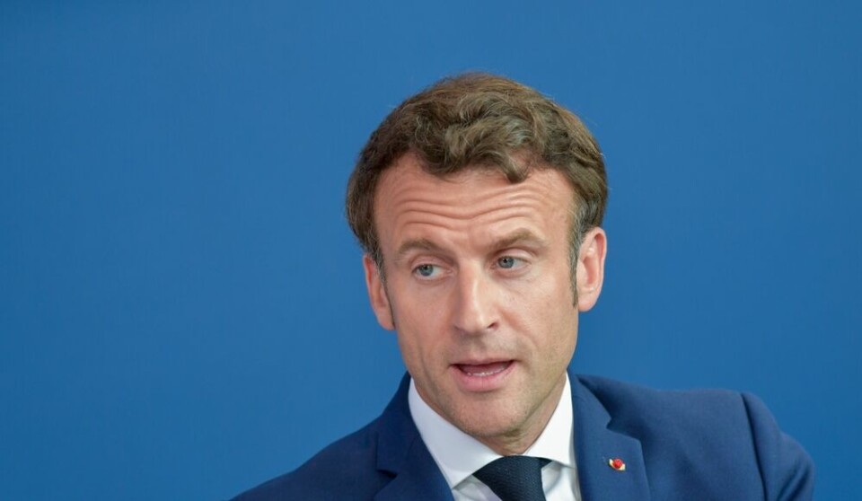 A view of President Macron against a blue background