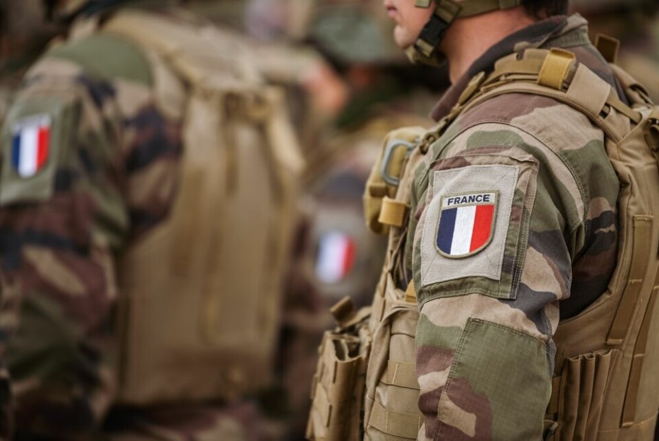 A view of French army soldiers lined up, wearing camouflage