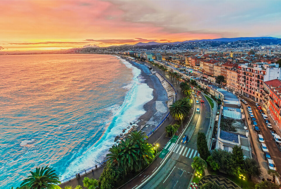 A view of the Nice shoreline and Promenade des Anglais at sunset