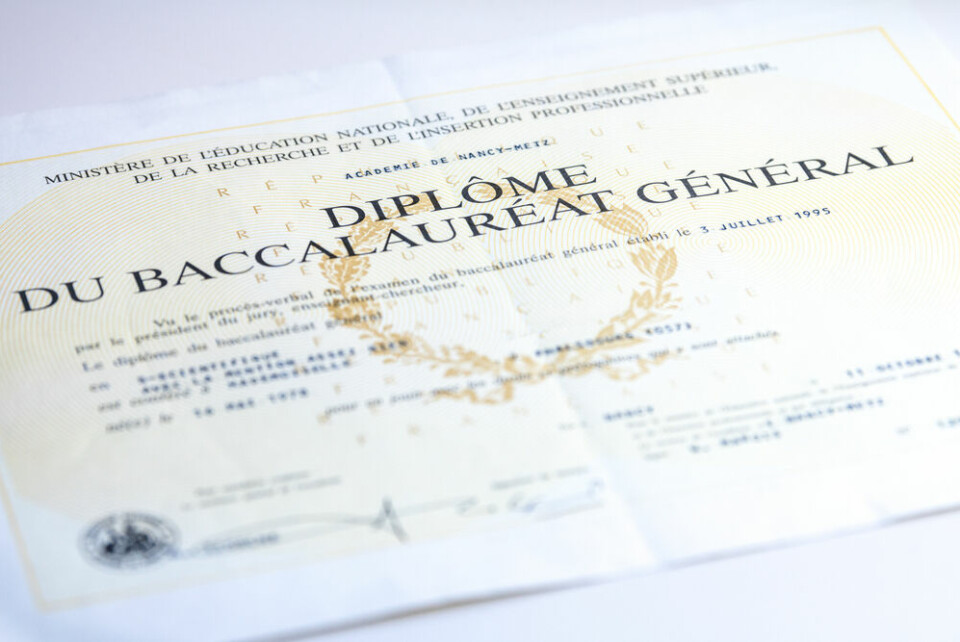A French baccalauréat général certificate on a table