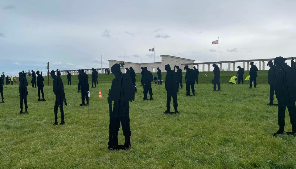 Silhouette installation of British soldiers on a beach in Normandy, as part of the Normandy War Memorial