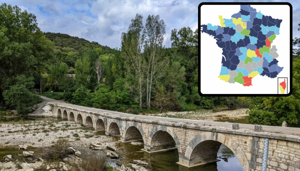 Medieval long bridge over a river showing low water level, inset map of water tables in France for April 2024