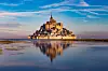 A view of Mont-Saint-Michel shimmering on the water