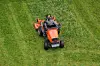 Man riding mower on lawn near toulouse, france