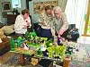 Elderly French women looking at knitted D-Day scene