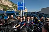 French far-right leader Jordan Bardella surrounded by media at the border with italy