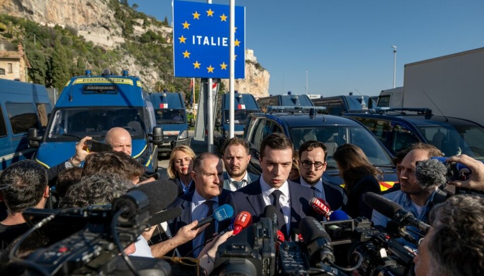 French far-right leader Jordan Bardella surrounded by media at the border with italy