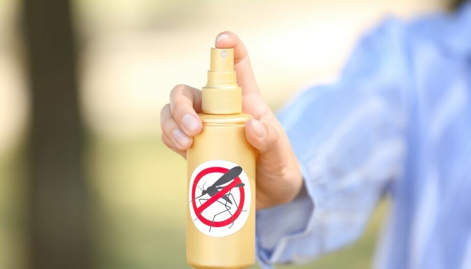 A view of a spray bottle with an anti-mosquito symbol on it