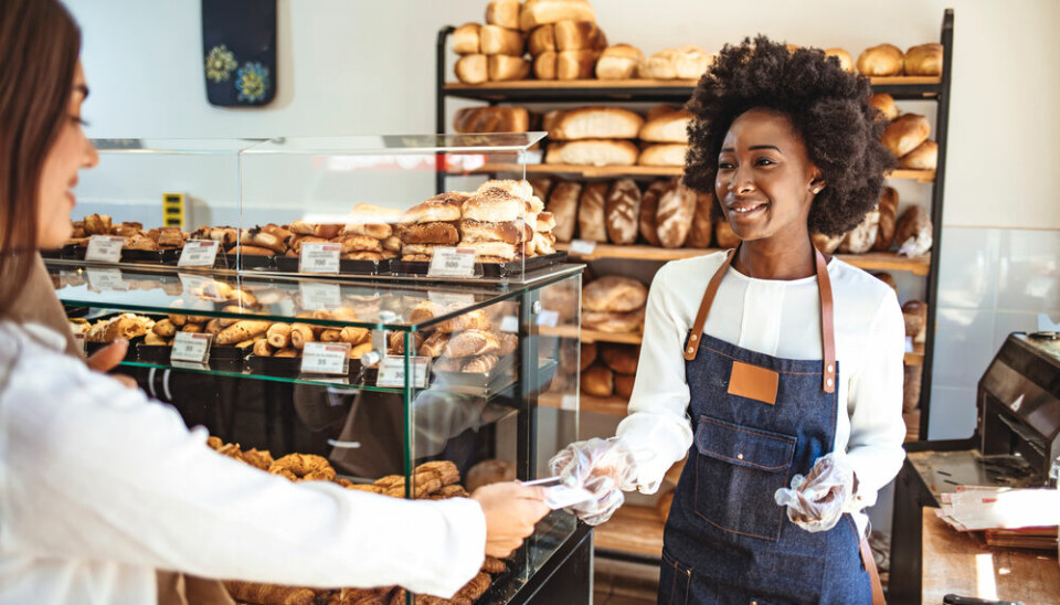 Customer paying by card in a bakery