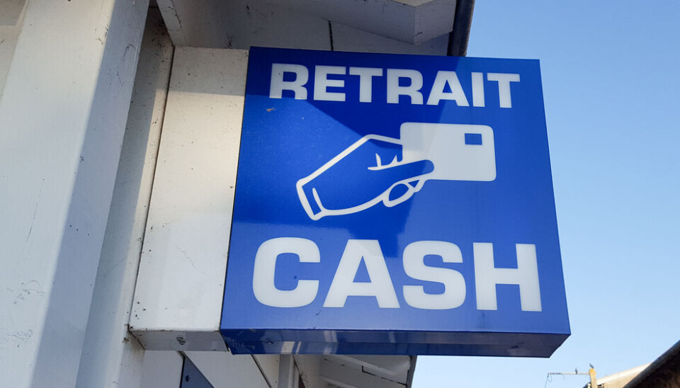 sylv1rob1/Shutterstock A sign reading ‘RETRAIT CASH’ to signpost an ATM in France