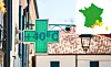 Split image of French pharmacy and map of weather alerts