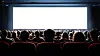 People in a cinema in front of a white screen