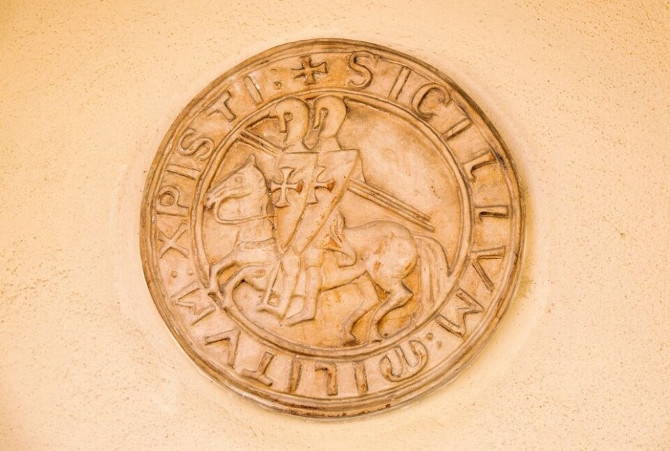 Fabrizio/Shutterstock Knight's templar seal on a wall