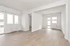 Empty,Living,Room,With,Laminated,Flooring,And,Recently,Finished,Smooth