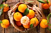 Clementine-,Mandarin,Fruit,And,Leaf,Background