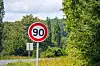 A view of a 90 km/h speed limit sign in France